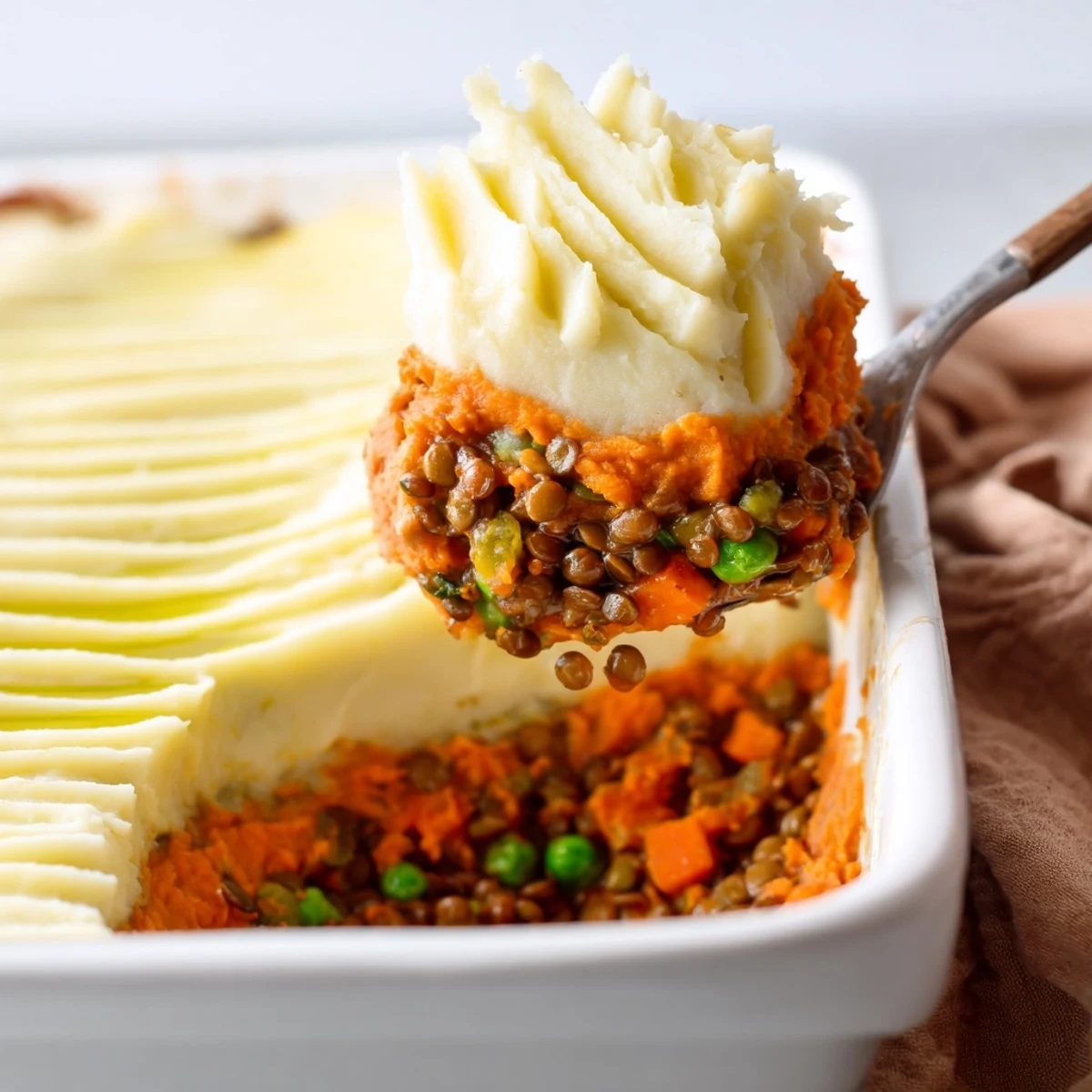 Golden-topped Veggie Shepherds Pie: a comforting dish with creamy sweet potato and lentils.