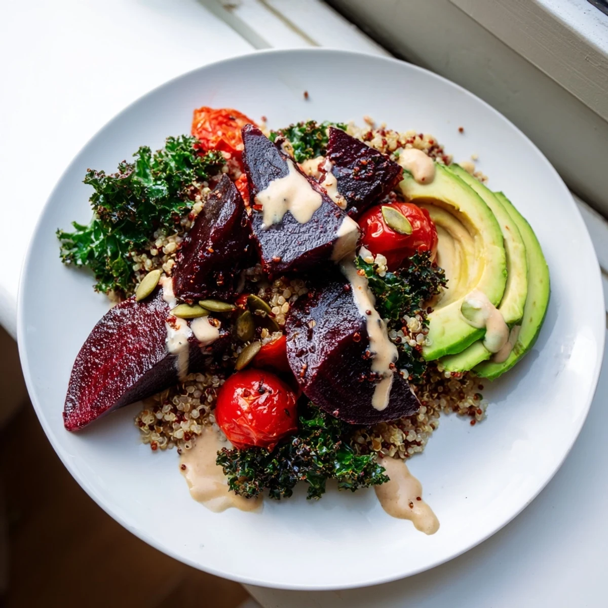 Vibrant quinoa, kale & roasted beet bowl: imagine the colorful beets nestled beside fluffy quinoa with creamy dressing.