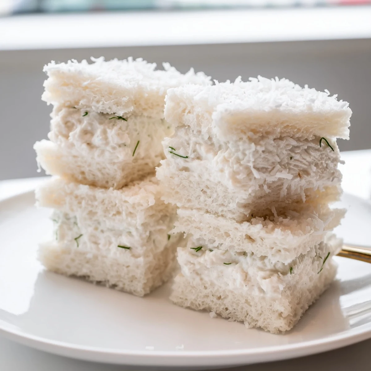 Freshly made Snowball Tea Sandwich Bites offer a delightful, snowy texture and savory flavor.