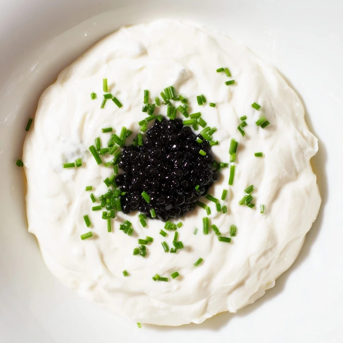 Close-up of a decadent Diamond Inlay appetizer featuring caviar, ready to be served on a cracker.