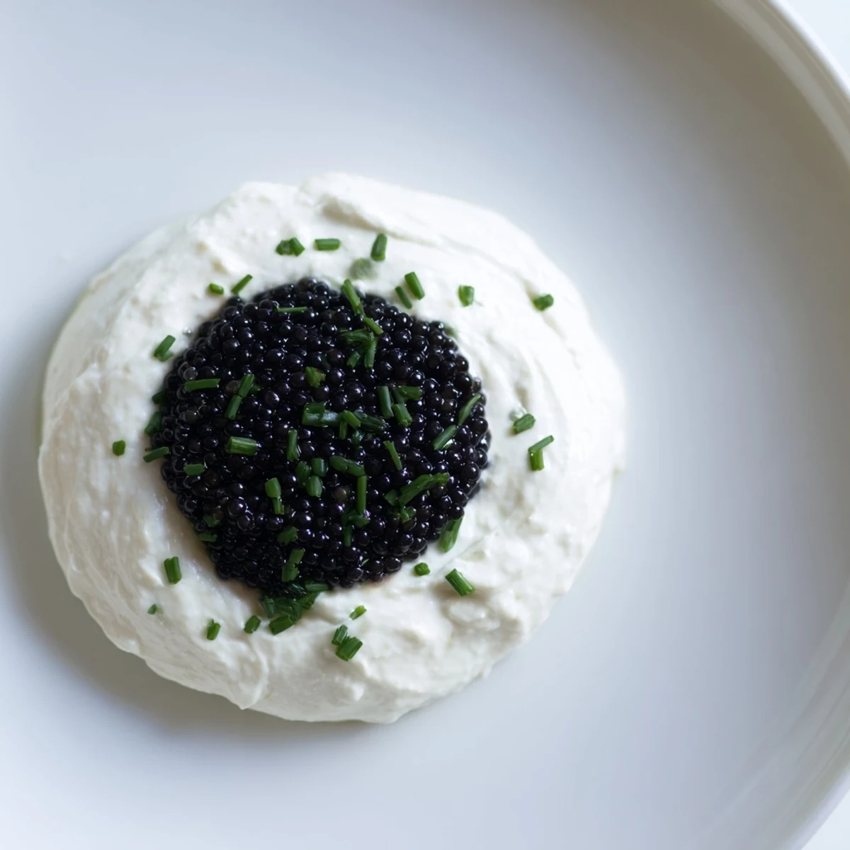 Delicate Diamond Inlay appetizer: a creamy ring encasing the rich, dark jewel of tapenade.