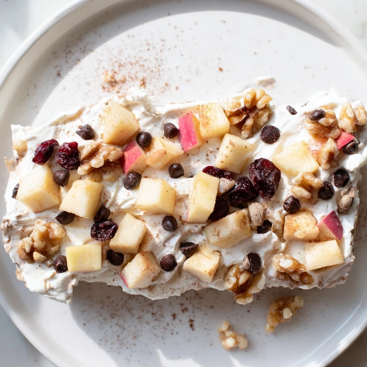 Enjoy a close-up of this beautiful Apple Cinnamon Yogurt Bark, ready for a delightful, refreshing bite.