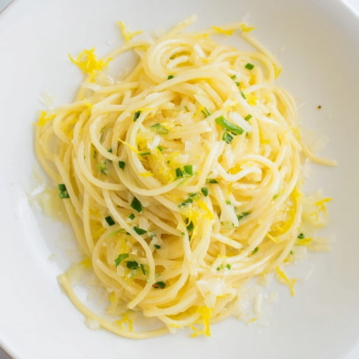 Steaming Lemon Capellini with fresh herbs, a bright and flavorful Italian pasta dish.