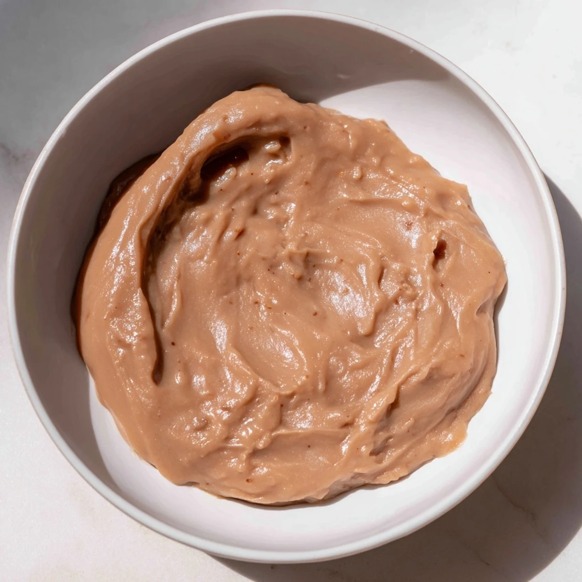 Fragrant and rich Emirati Al Madrooba; a close-up shows the smooth, date-infused paste perfect for spreading.