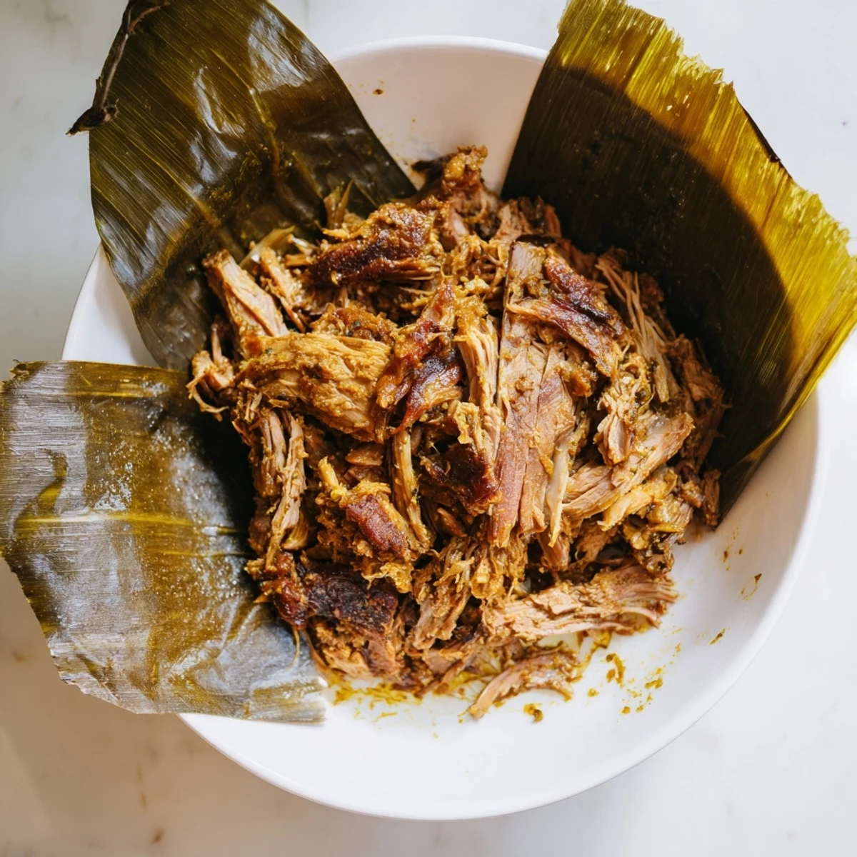 Tender Omani Shuwa meat, fall-apart cooked and rich with aromatic spices, ready to serve, a Middle Eastern delight.