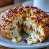 Chewy jalapeño cheddar protein bagels with melted cheese and spicy jalapeño slices, perfect for breakfast sandwiches.  
