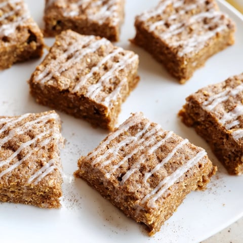 Soft Chai-Spiced Gingerbread Bars, drizzled with glaze, perfect for warm gatherings.  