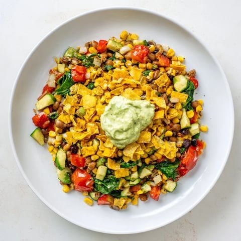 Vibrant close-up of a Veggie-Packed Taco Skillet with melted cheese and fresh cilantro garnishing.