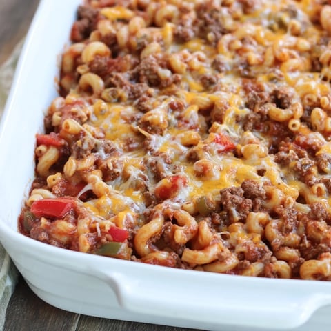 Hamburger Casserole bubbling with melted cheese, promising a warm, comforting family meal.
