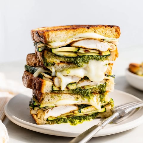 Golden-brown Pesto Turkey Zucchini Grilled Cheese Stack, oozing with melted provolone and flavorful pesto.