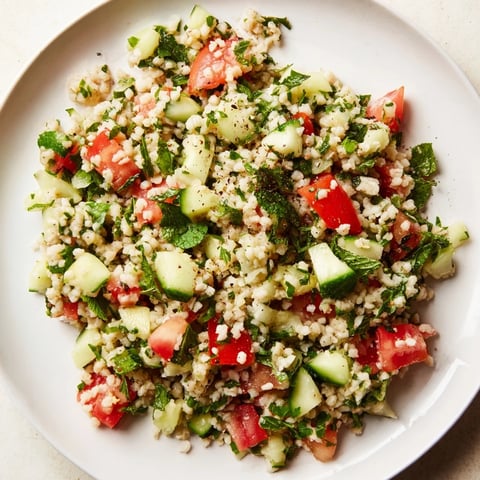 A bright, close-up shot of Lebanese Tabbouleh Salad, showcasing fresh herbs and vegetables.