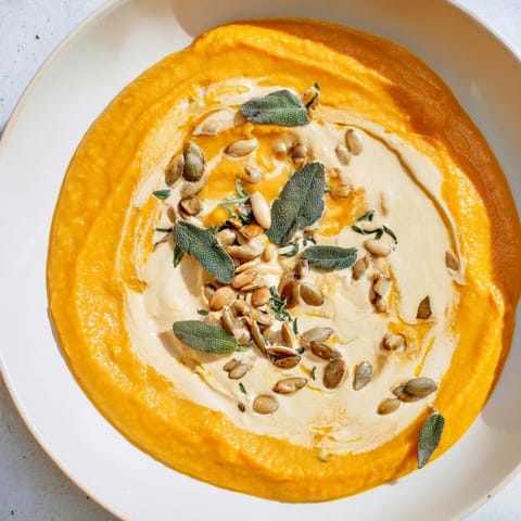 Aromatic Chickpea, Pumpkin & Sage Soup, featuring roasted pumpkin and flavorful sage, ready to eat.