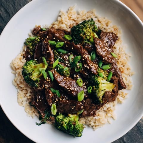 This delicious slow-cooker beef & broccoli recipe features a hearty, comforting meal served over brown rice.