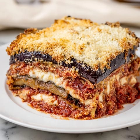 Creamy layers of ricotta and mozzarella are nestled within this delicious Eggplant Parmesan Lasagna.