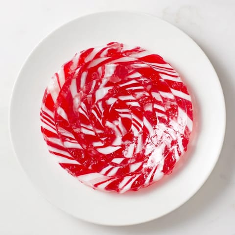 Shiny, vibrant pink No-Bake Peppermint Candy Bowl ready to hold delicious Christmas goodies for everyone.