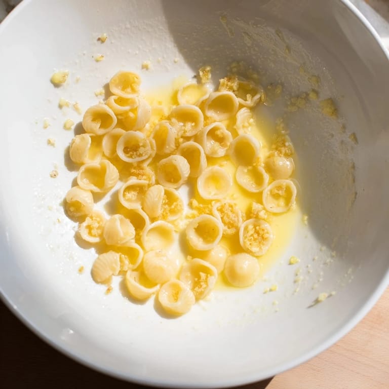 Warm and savory, a close-up of buttery garlic ditalini, perfect for a quick Italian dinner.